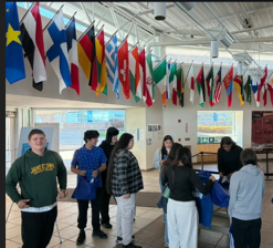 Students gathered under flags