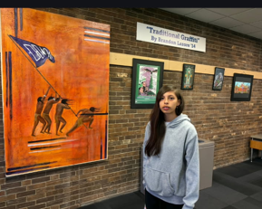female student by Native American artwork