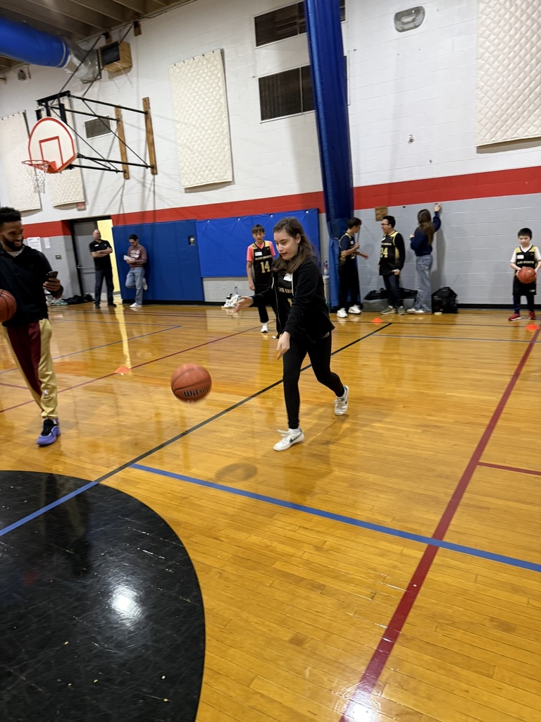 A student practices dribbling. 