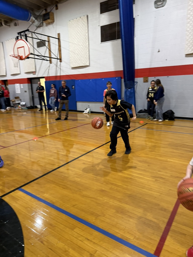 A student practices dribbling. 