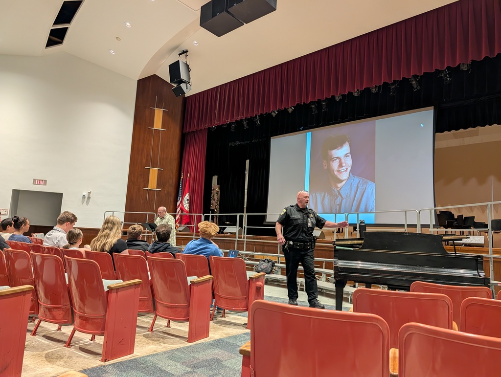 Deputy Johnson and Mr. Brown in aud with students