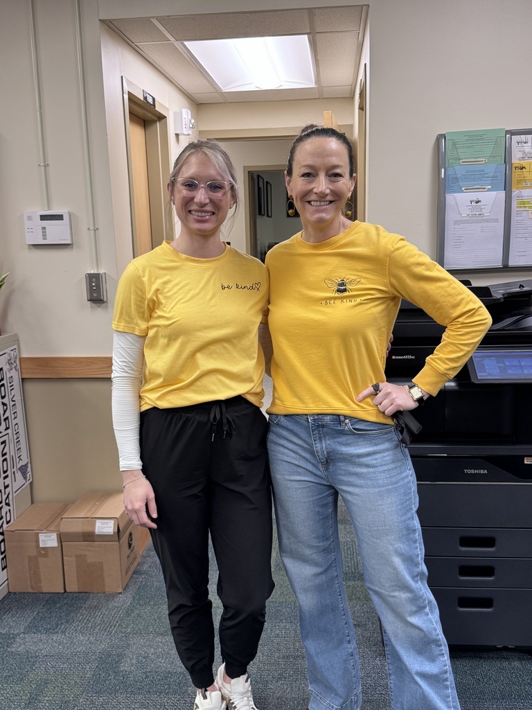Ms. Neubauer & Dr. Ralston in yellow "Be Kind" shirts