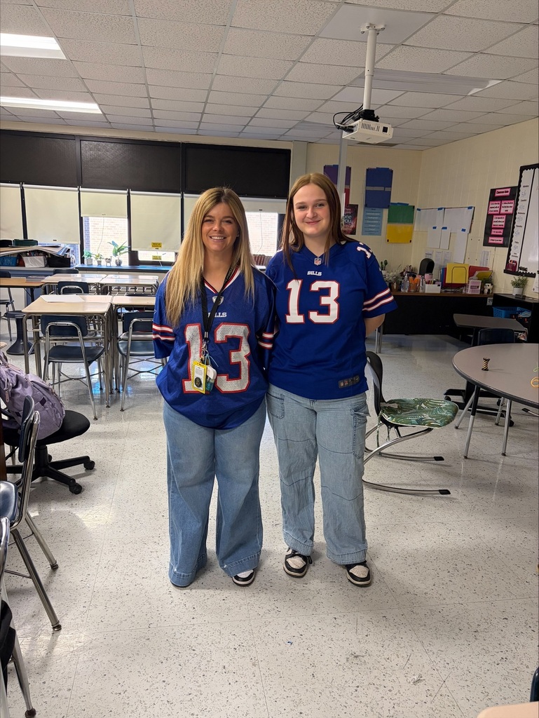 Mrs. Hamms and student in Bills jerseys