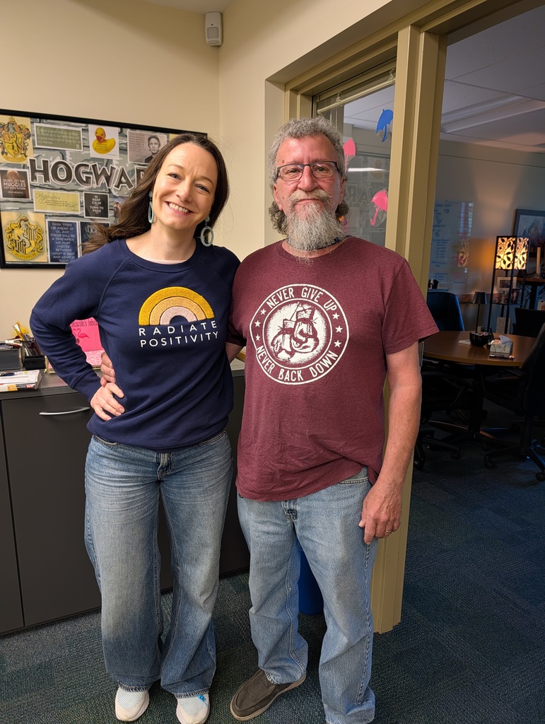 Dr. Ralston and Wally in positive quote t-shirts