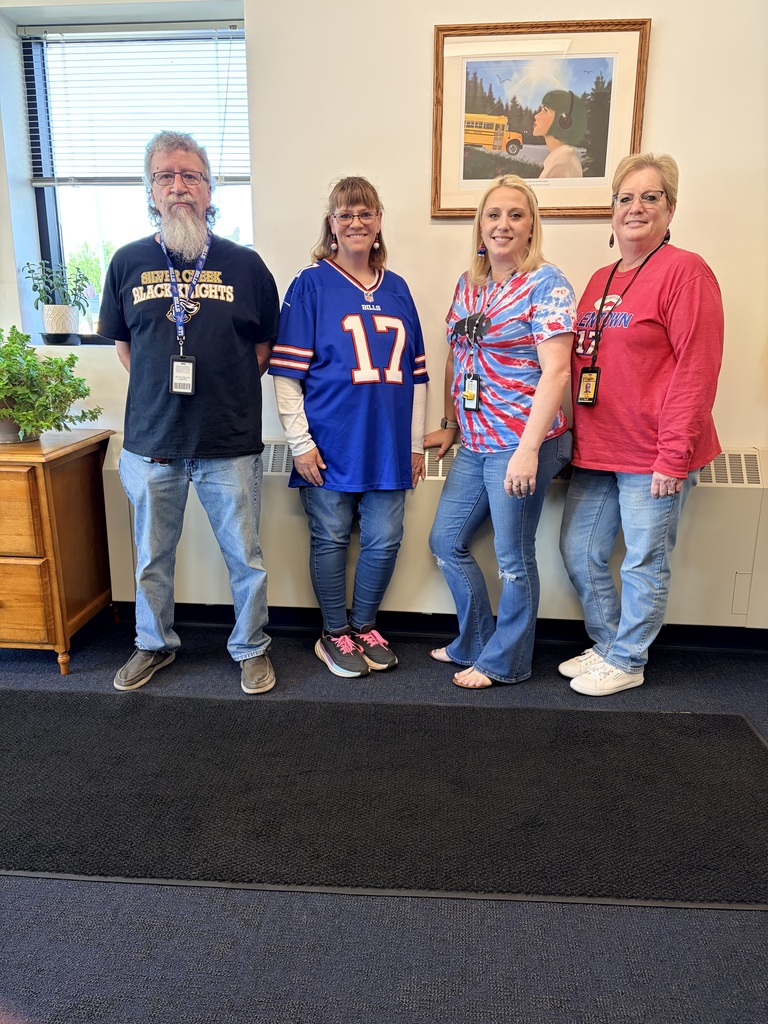 Bus garage staff in Bills gear. 