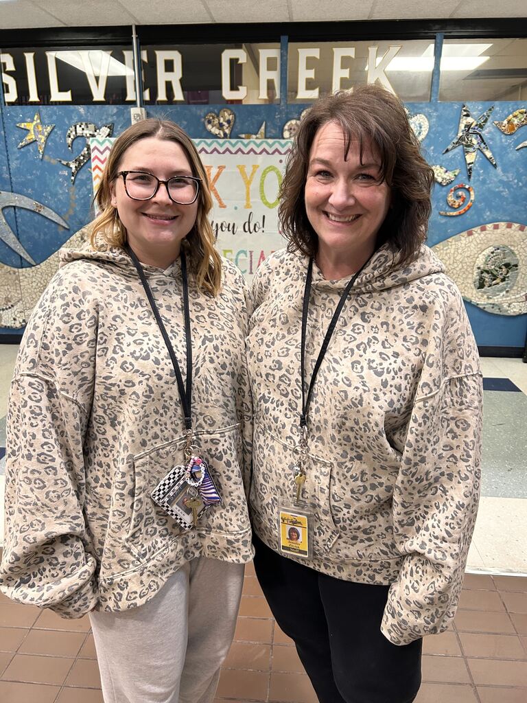 Miss Mohan and Ms. Zbytek in white leopard hoodies