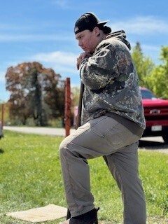 Mr. Jones leaning on shovel