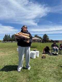 Student carrying wood