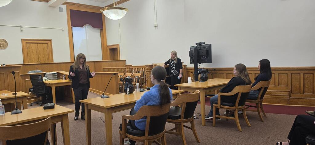students seated in a courtroom