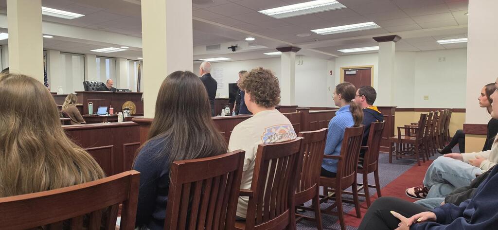 students seatedin a courtroom