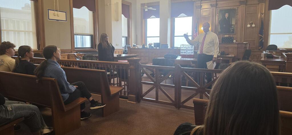 students seated in courtroom