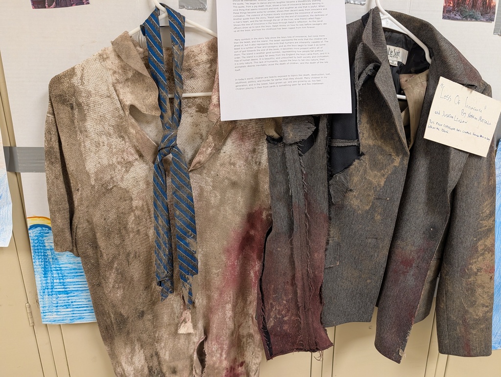 dirty, tatteret clothes hanging in gallery