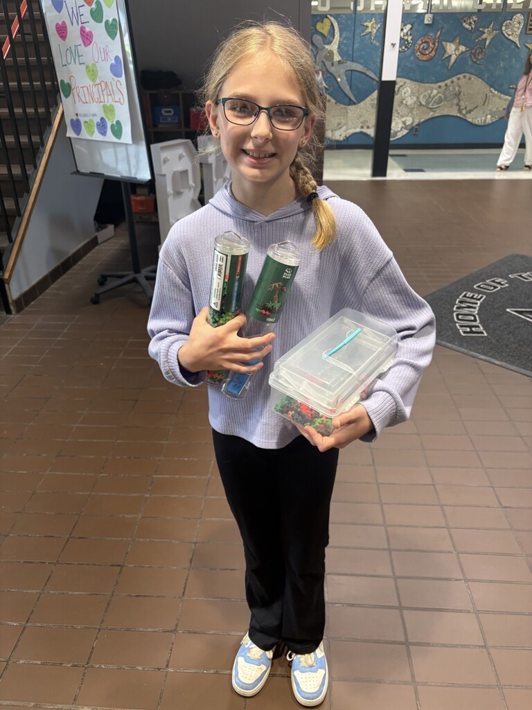 Riley holding a prize bundle