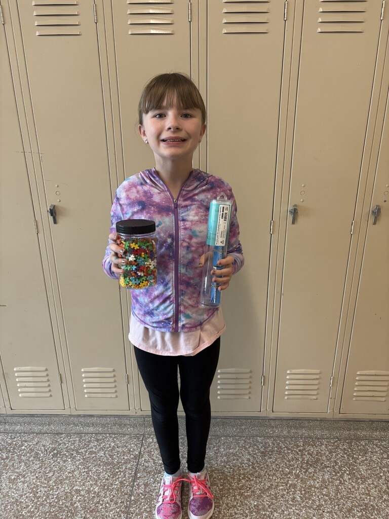 Katelynn holding a prize bundle