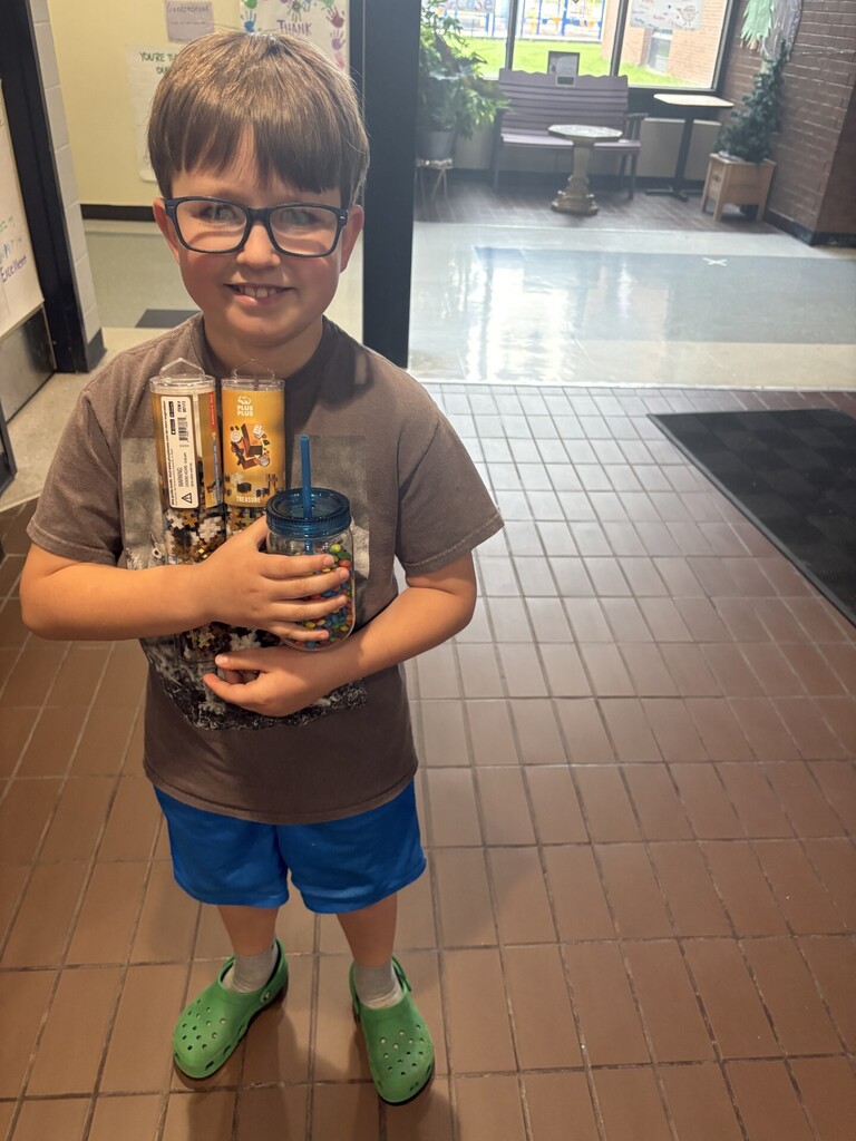 Henry holding a prize bundle