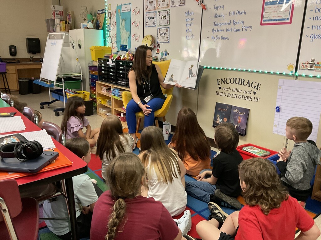 Dr. Ralston reading to students