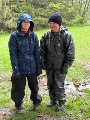 2 students in rain gear