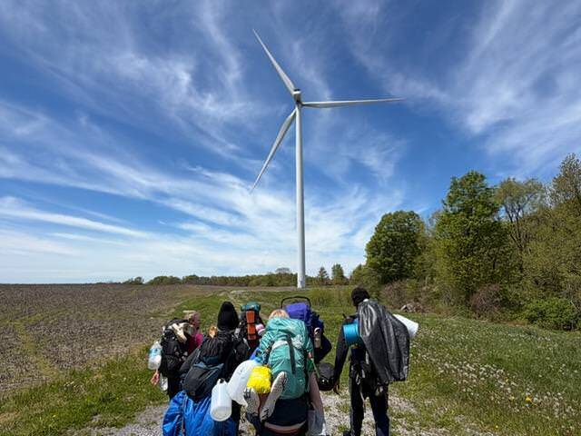 hikers near windmill
