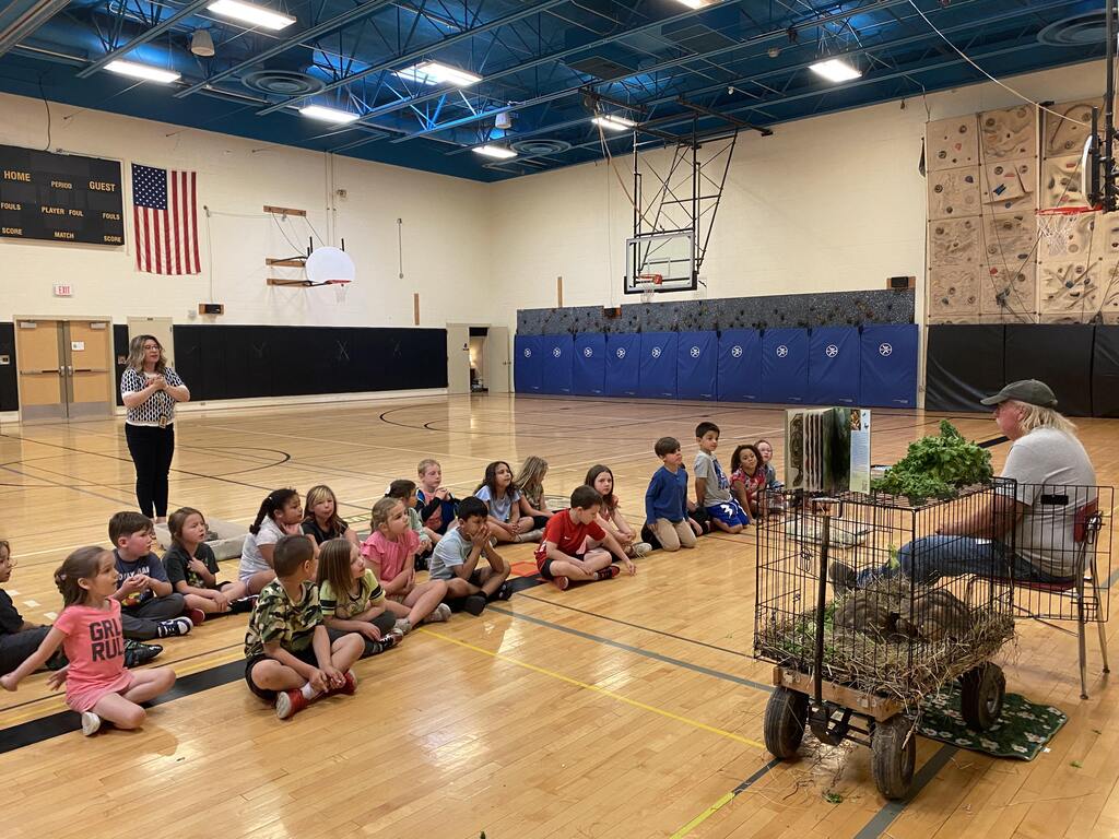 Students listen to Mr. Morton speak about tortoises