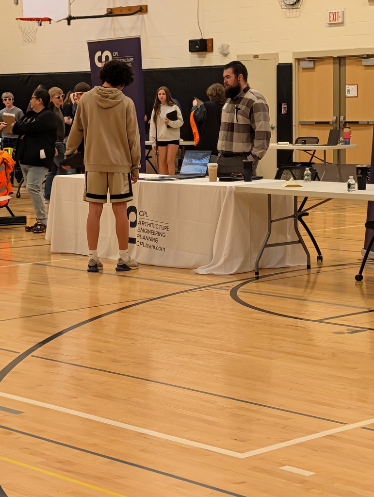 students speaking to career professionals