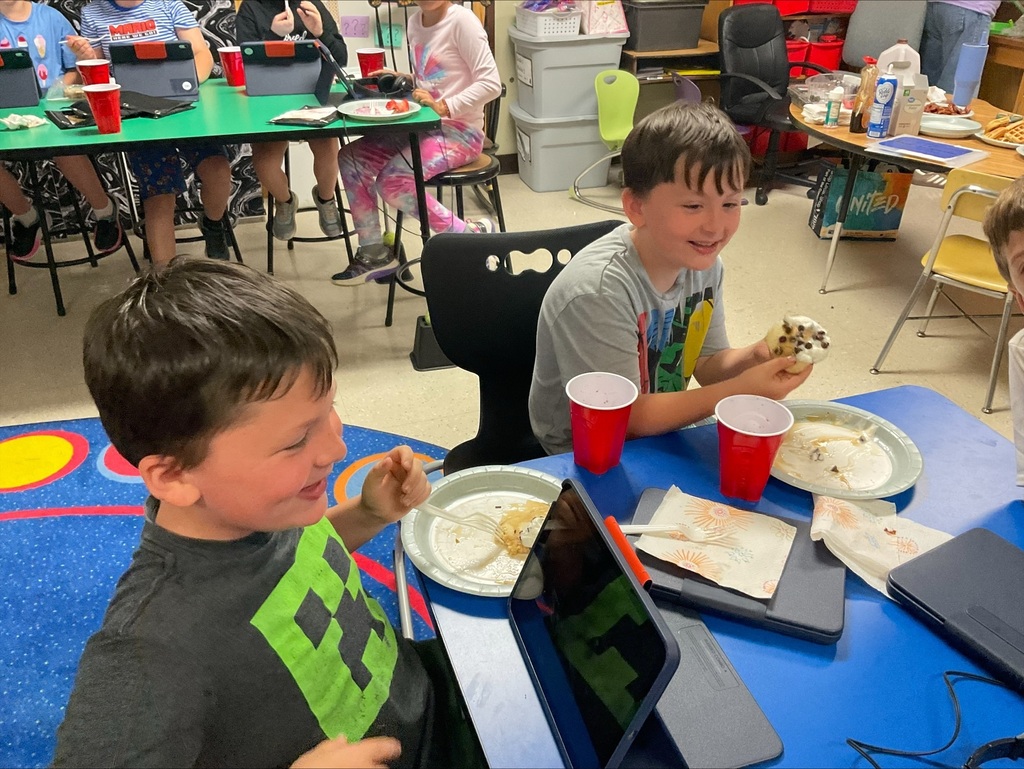 students eat pancakes at the party. 