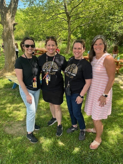Teachers pose for a photo.