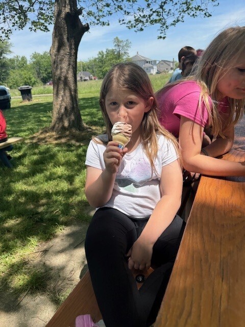 A student eats ice cream.