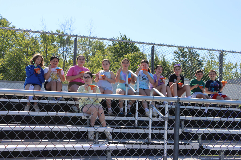 Students eat snow cones. 