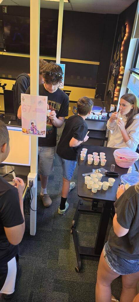 students sampling ice cream in classroom