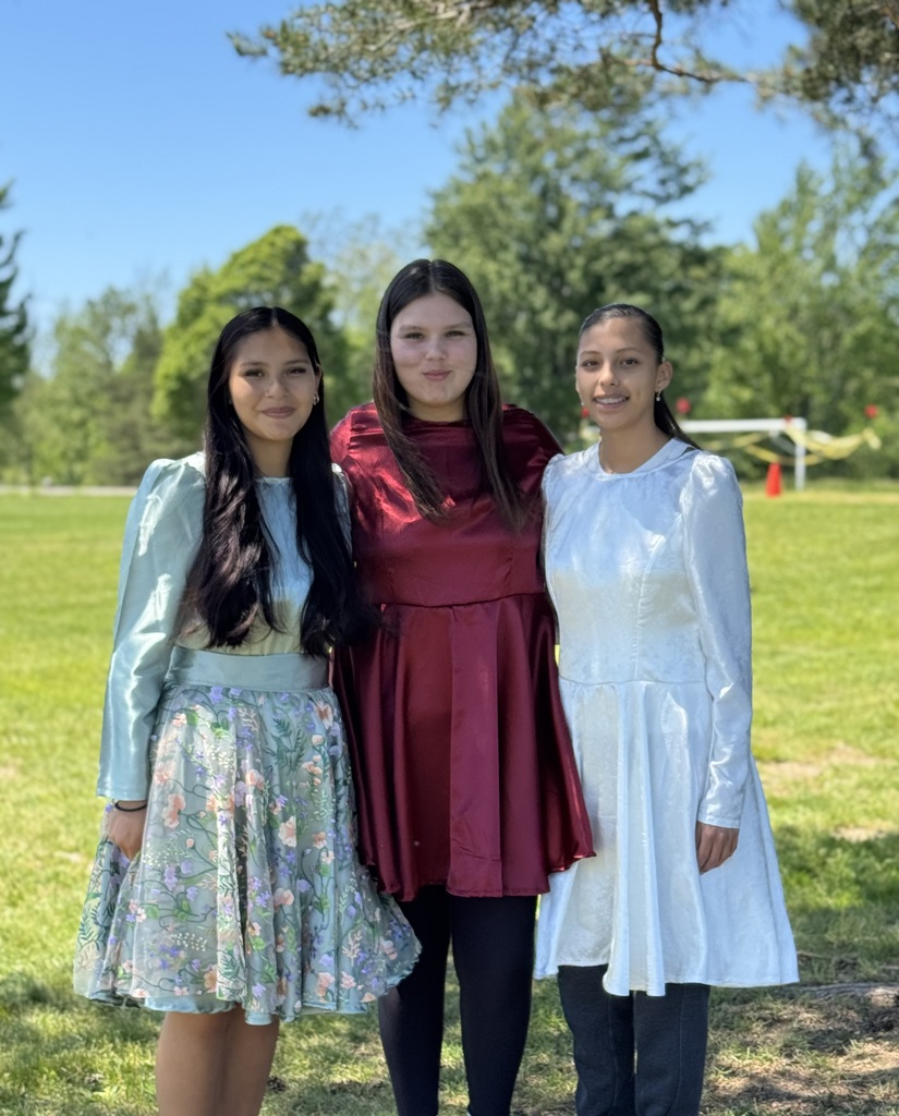 Three girls in their dresses.