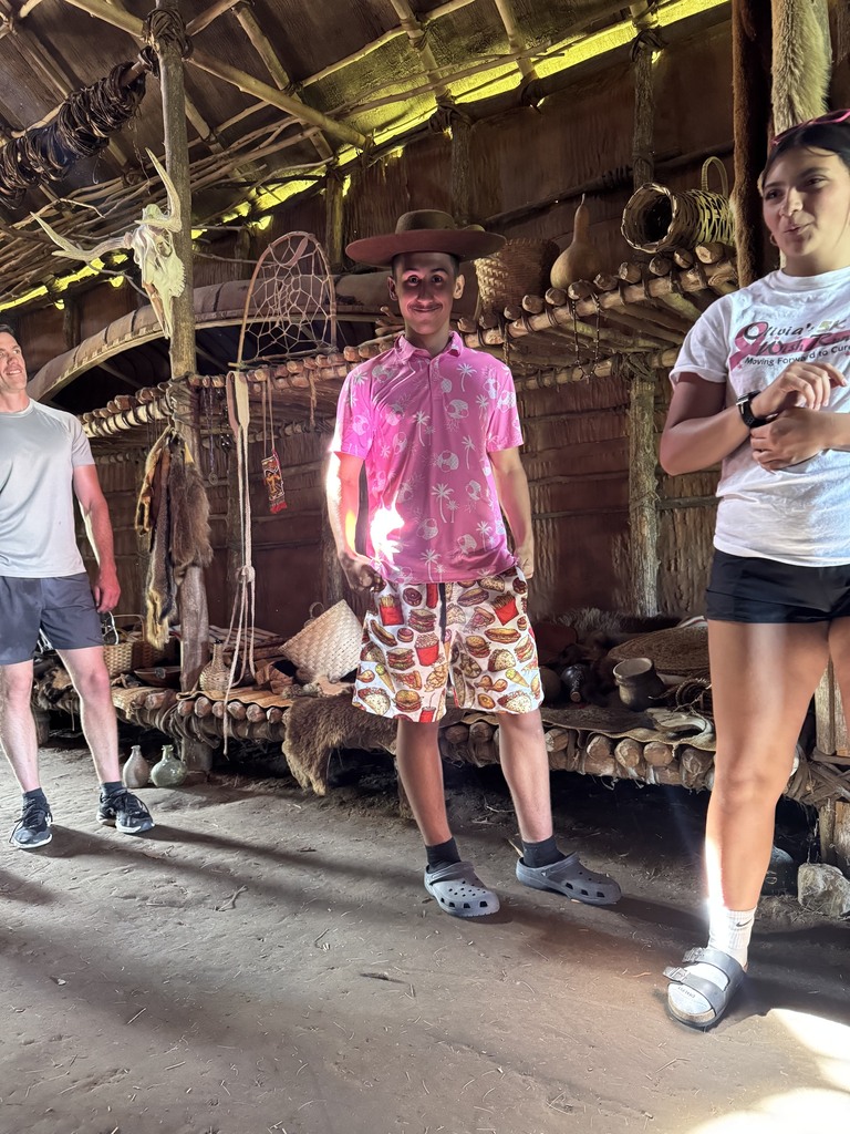 Students in the long house.