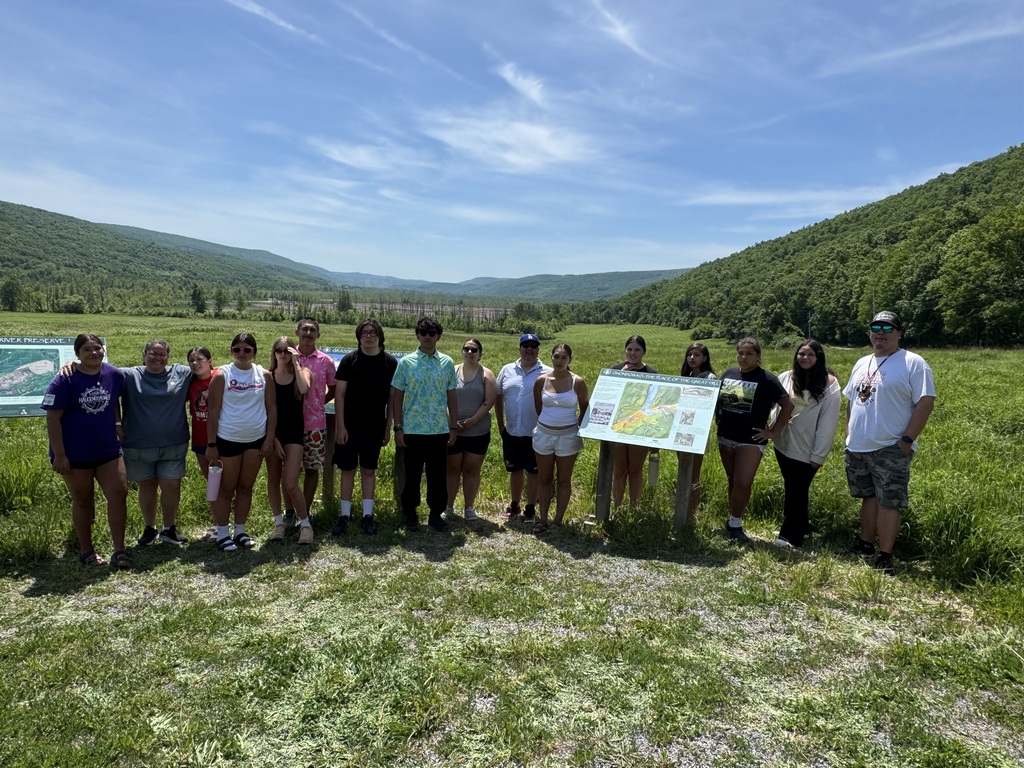 Group photo near historic site. 