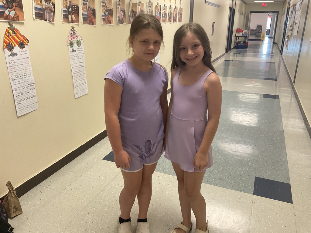 Girls in matching purple outfits