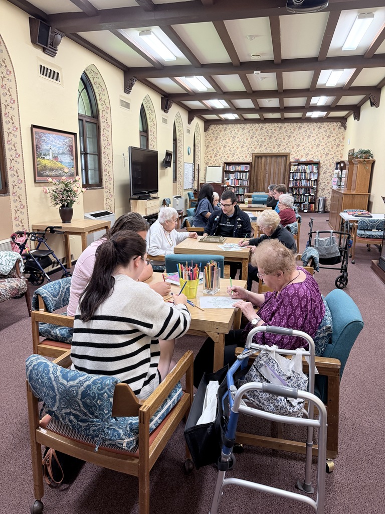 students color with senior residents