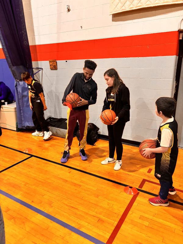 Kori is instructed by a Cavalier's Youth Coach