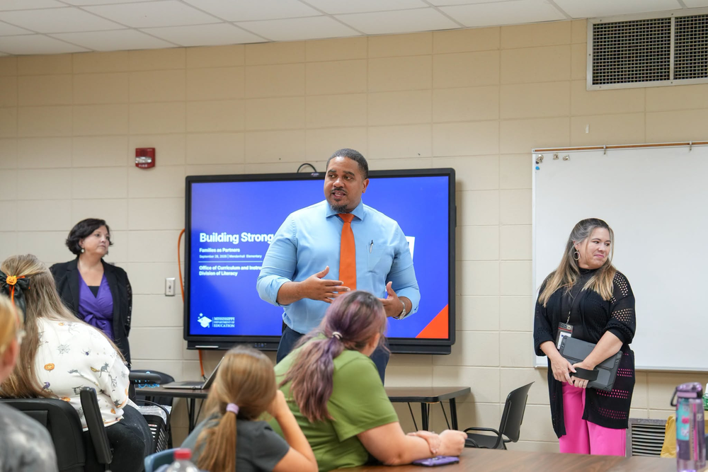 Mendenhall Elementary Principal talking to a group of parents.