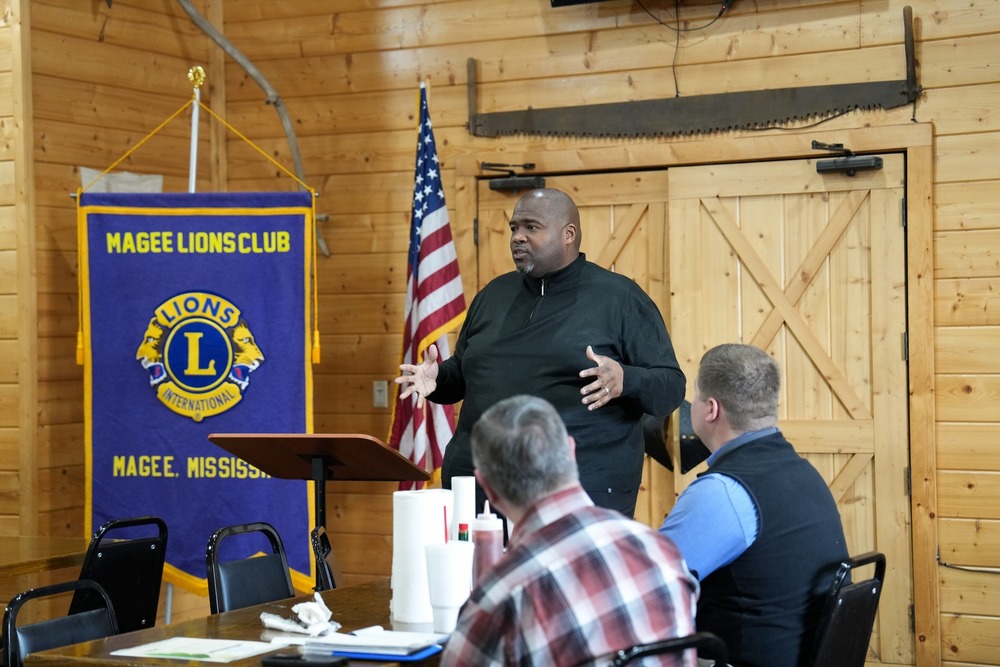 Superintendent Dr. Robert Sanders speaking a Magee Lions Club Meeting.