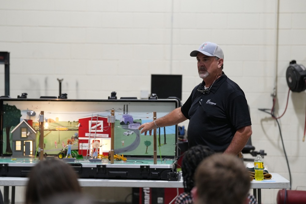 John Shoemaker speaking with Career and Technical Education students about the importance of staying safe around electricity.
