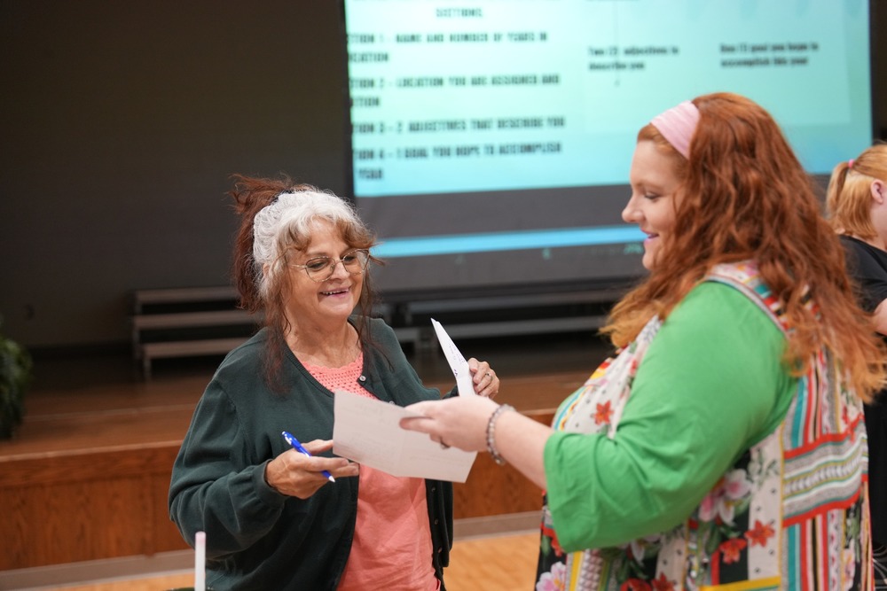 Two ladies meet at the New Employee Orientation