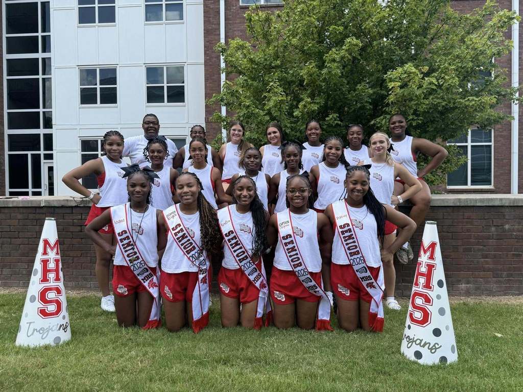 Magee High School Cheer team pose for a picture at cheer camp.