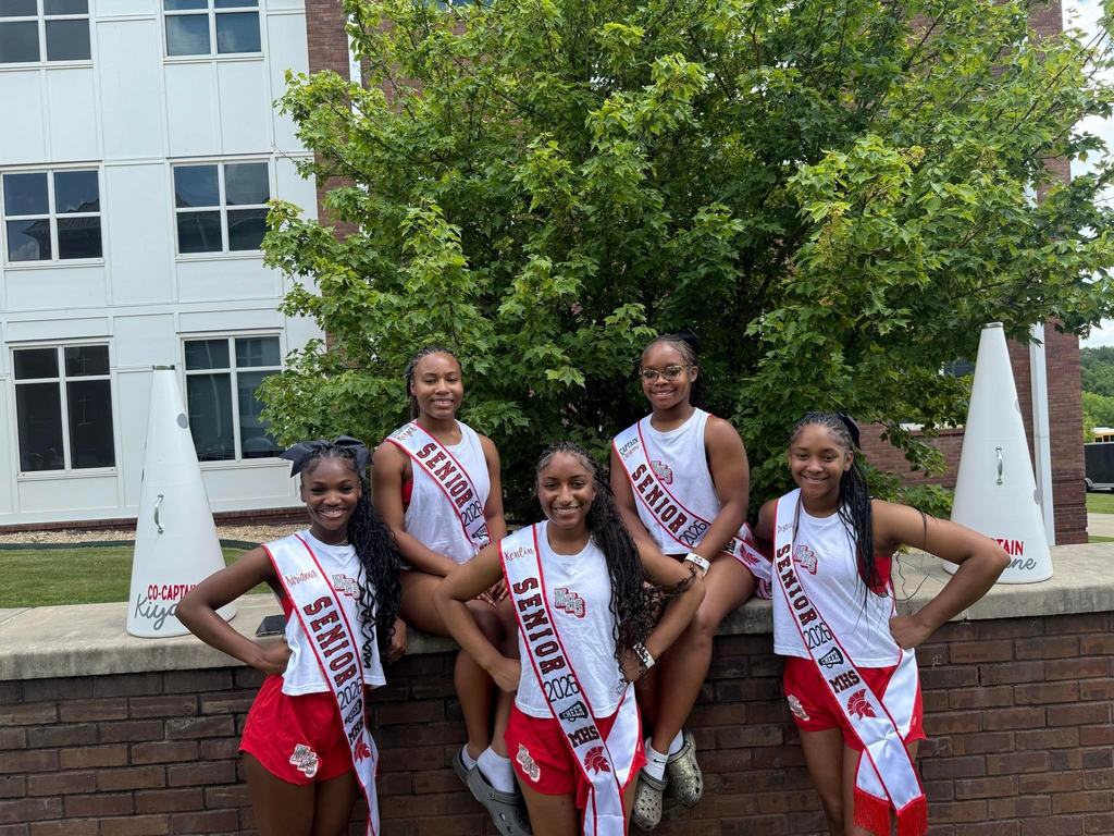 Magee High School Cheer senior pose for a picture at cheer camp.