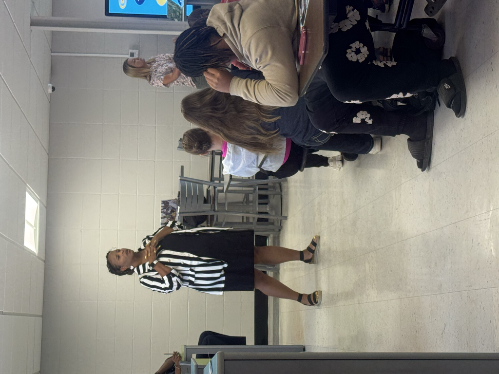 Curriculum team members speak to seniors.