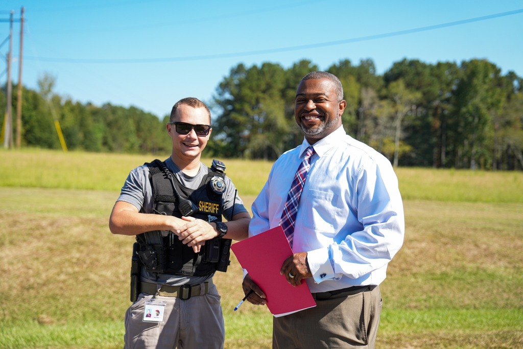 Magee High School Principal Duriel Jammal Banks and School Resource Officer Ryan May pose for a photo. 