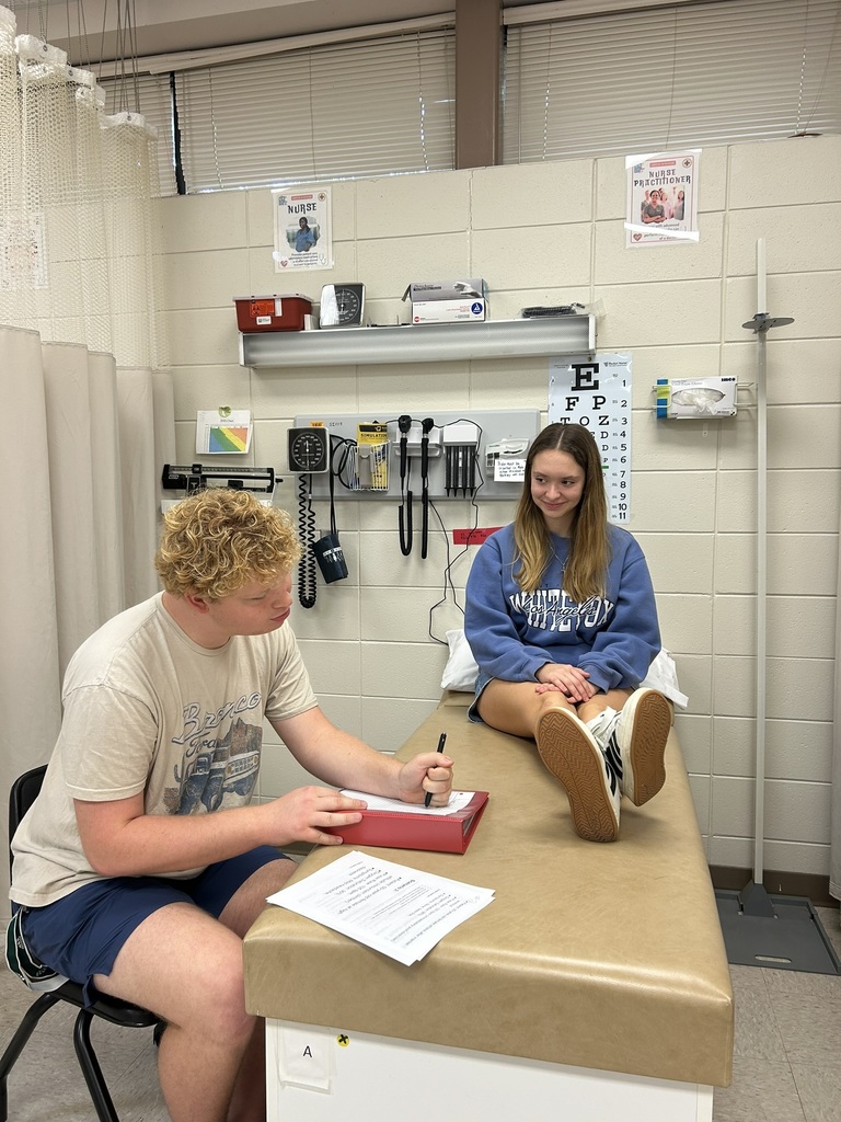 Health Science students practice taking pulses