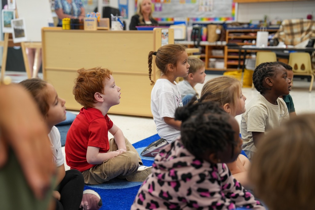 Students listening to First Lady of Mississippi, Elee Reeves, read to Pre-K students. 