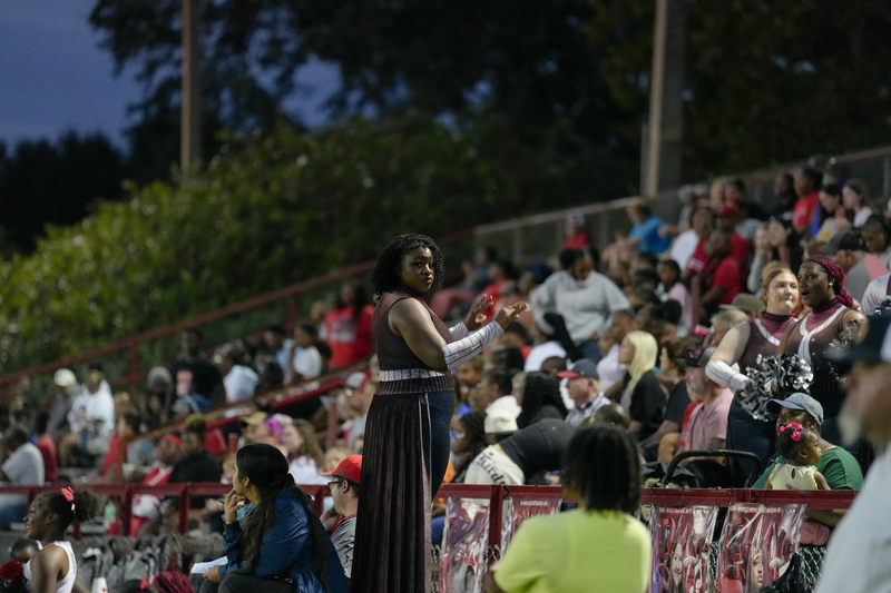Magee High School drum major conducting the band