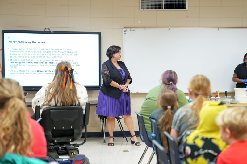 MDE representative talking to families.