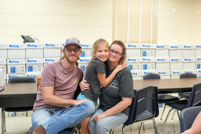 A family smiling for a photo.