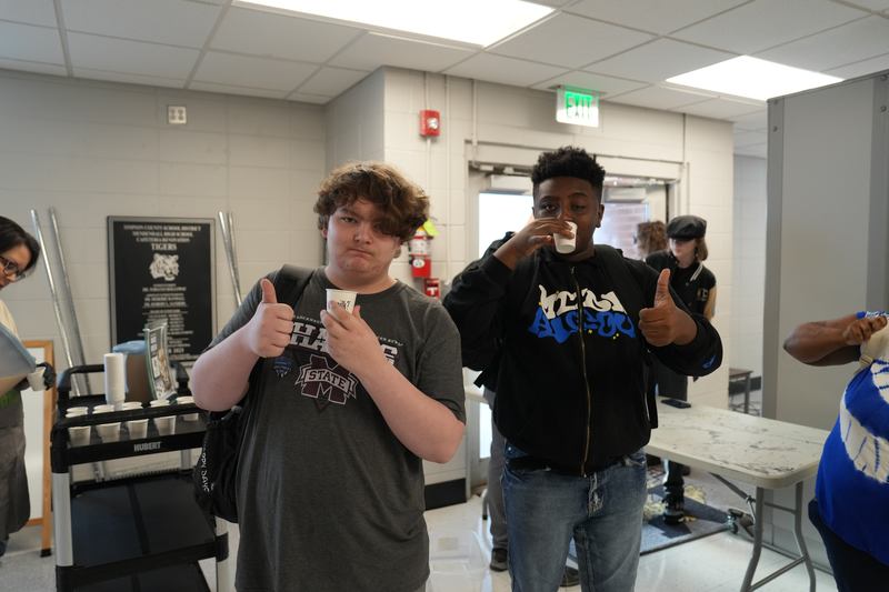 Hiigh school students give a thumbs up for Moo Brew Coffee