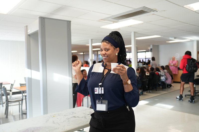 A teacher gives a thumbs up for Moo Brew Coffee